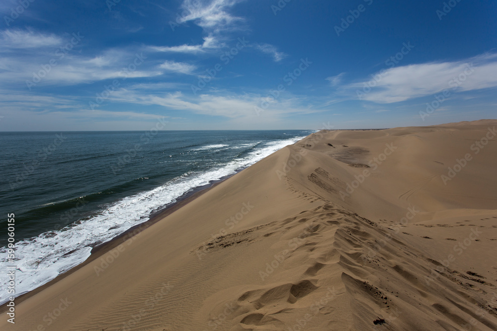 Photo of Walvis bay where sand of Namib meet the sea
