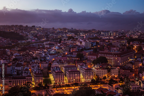 Sunset over buildings in Lisbon, Portugal. Architecture and nature in Europe