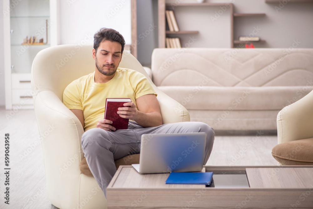Young man working from home during pandemic Young man working from home during pandemic