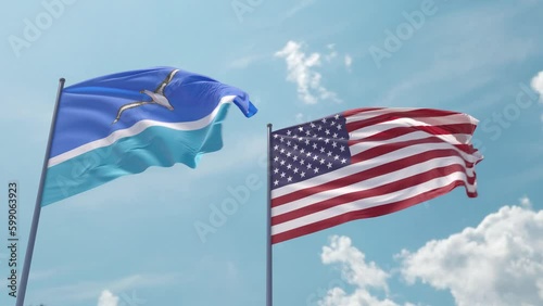 Midway Atoll and the USA on a flagpole realistic wave on strong wind in blue sky. Midway Islands and The United States of America photo