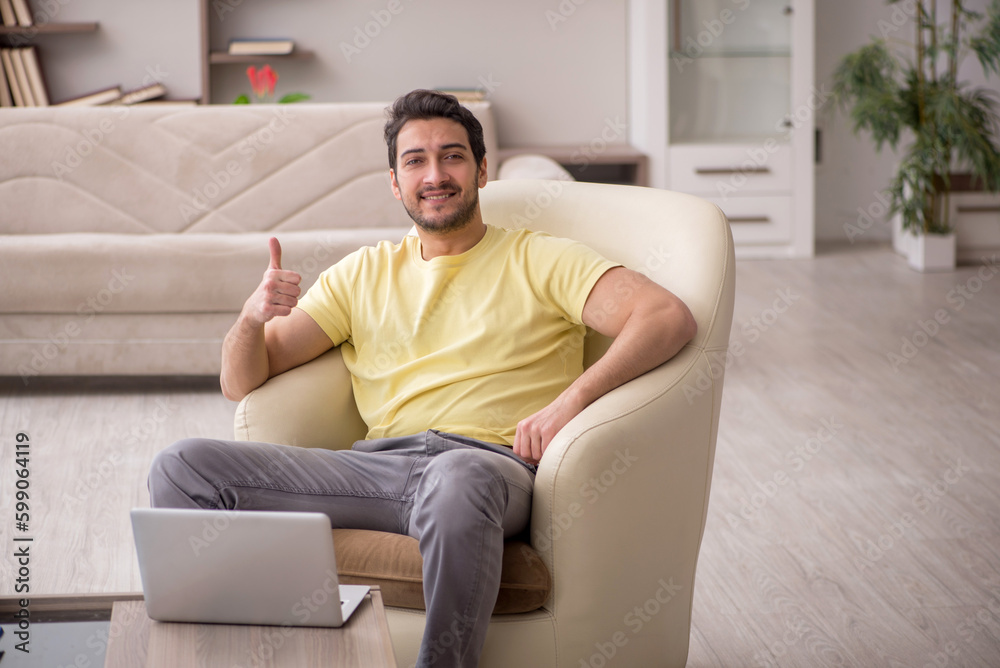 Young man working from home during pandemic