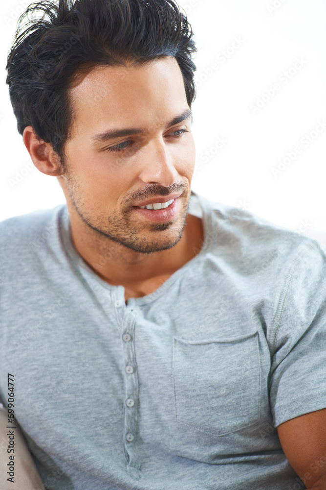 Fototapeta premium Sorry, girls, this hunk is taken. a handsome young man sitting indoors.