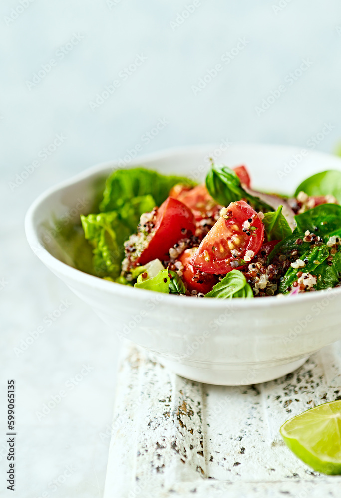 Quinoa salad with cherry tomato, lettuce, spinach and herbs Quinoa salad with cherry tomato, lettuce, spinach and herbs