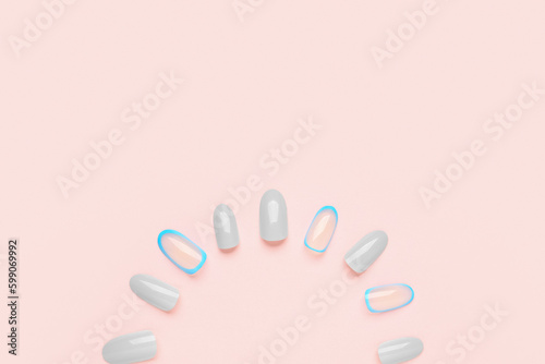 Press-on nails on pink background