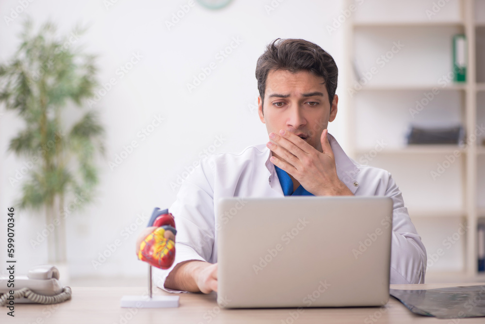 Young male doctor in telemedicine concept Young male doctor in telemedicine concept