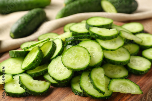 Pieces of fresh cucumber on table, closeup