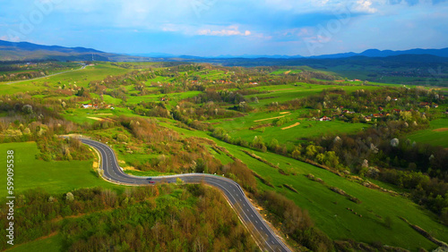 Curved road, Apuseni mountains, Romania. Top aerial photography.