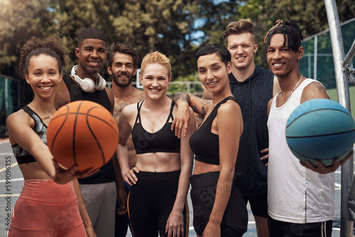 Participating in youth basketball is a fun way to build friendships. Portrait of a group of sporty young people standing together on a sports court. © Nicholas Felix/peopleimages.com