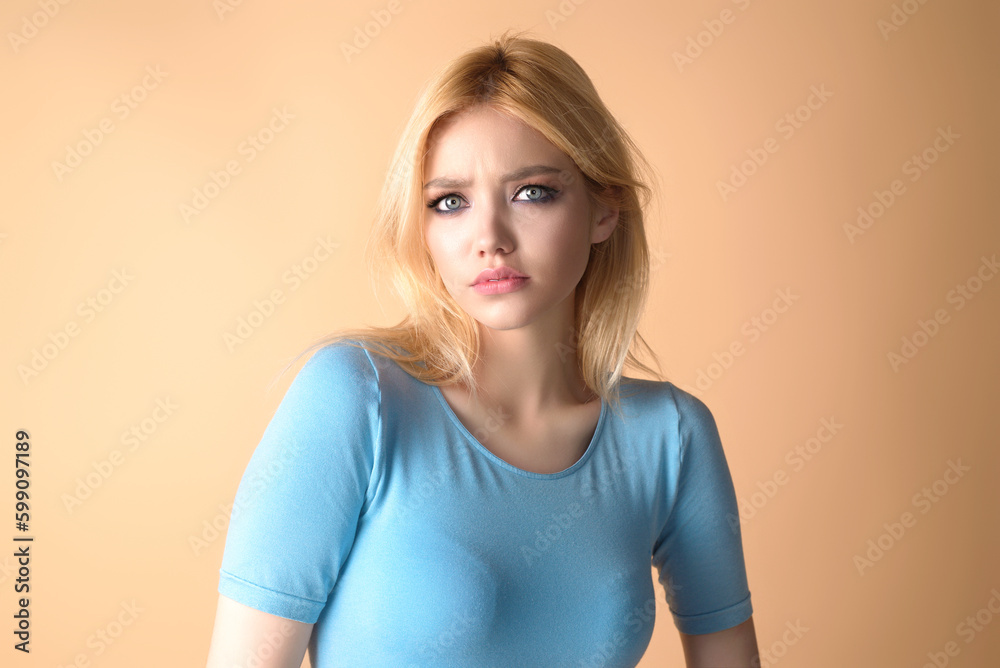 Fashion beauty portrait of young woman with evening stylish makeup and perfect clean skin. Sexy model posing in studio. Portrait of beautiful young girl with bare shoulders. Natural woman.