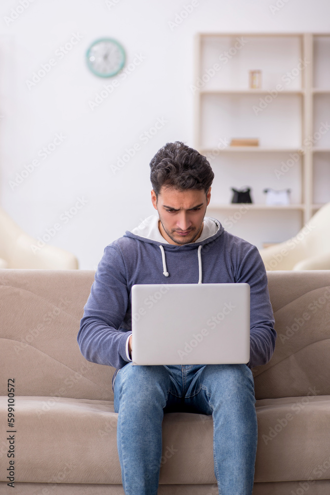 Young male freelancer working from home Young male freelancer working from home
