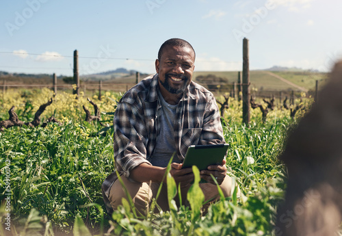 With digital tech farming gets easier by the day. a mature man using a digital tablet while working on a farm.