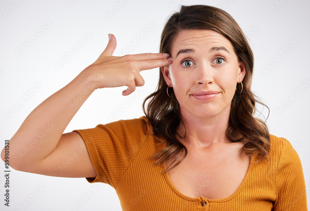 How I feel after a day at work. Studio shot of a young woman making a gun with her hands against a white background. How I feel after a day at work. Studio shot of a young woman making a gun with her hands against a white background.