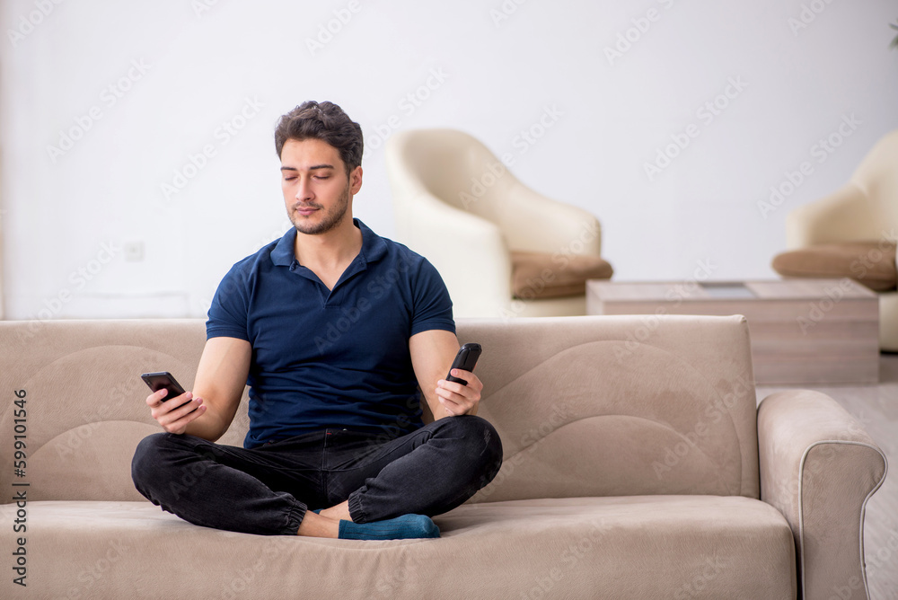 Young man sitting at home during pandemic Young man sitting at home during pandemic