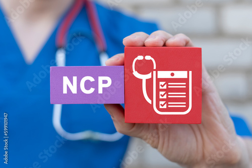 NCP Nursing Care Plan Medicine Concept. Doctor holding colorful blocks with medical icon and abbreviation: NCP. Long-term care. photo
