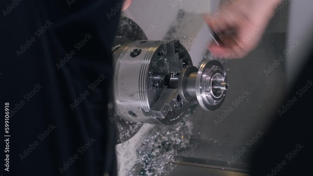 Male technician screws cinema lens workpiece on lathe and measures it with measuring tool. Metalworking and cinema lenses production. Concept of manufacturing and industrial equipment. Generative AI Male technician screws cinema lens workpiece on lathe and measures it with measuring tool. Metalworking and cinema lenses production. Concept of manufacturing and industrial equipment. Generative AI