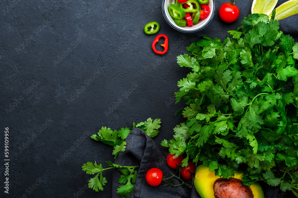 Φωτογραφία Fresh cilantro or coriander, chili and jalapeno peppers, avocado, lime and cherry tomatoes - ingredients for Mexican spicy cuisine