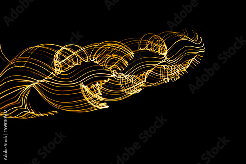 Curved lines formed by moving lights. traces of lights