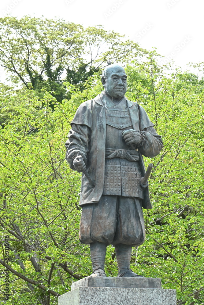 Fototapeta premium Statue of Tokugawa Ieyasu. Japan tourism Aichi Prefecture Okazaki Castle. He is a historical person who survived the age of civil wars and is a founder of Edo shogunate.