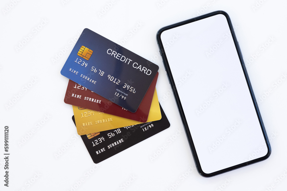 Smartphone and plastic credit card. mobile phone with blank white screen and bank card with chip. Credit card for finance and cell phone on light background