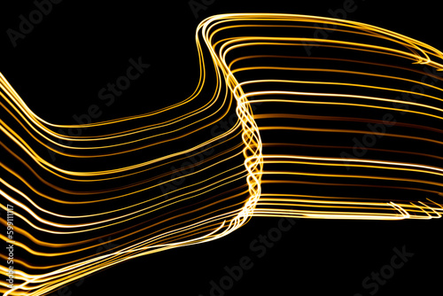 Curved lines formed by moving lights. traces of lights