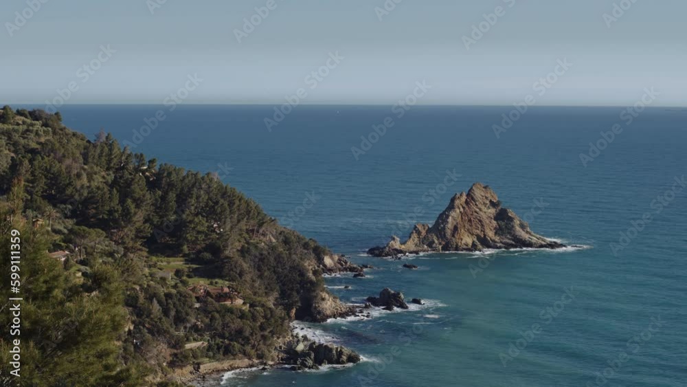 Hidden lesser known beach on Mediterranean coast of italy, sunny day pan Hidden lesser known beach on Mediterranean coast of italy, sunny day pan