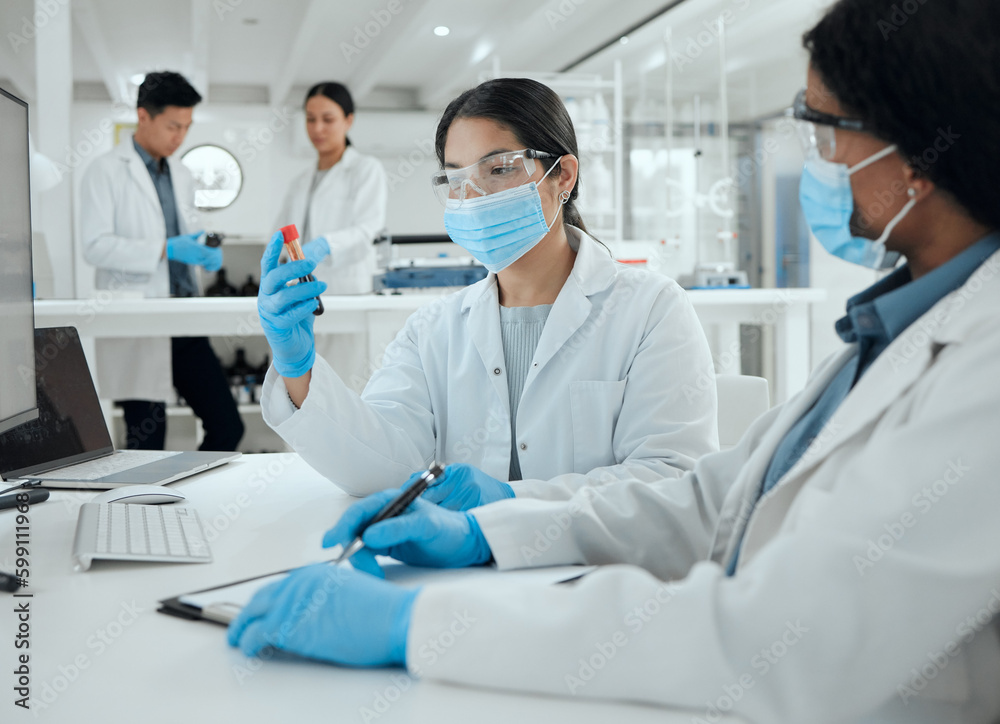 Youve shed so much light on this. two scientists reviewing a sample together. Youve shed so much light on this. two scientists reviewing a sample together.