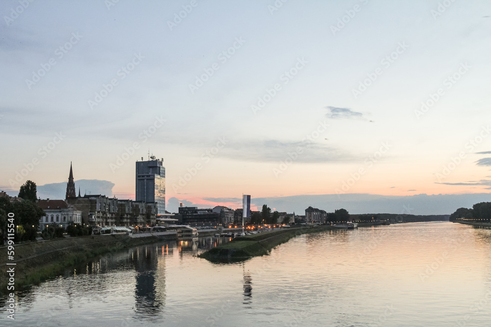 Panorama and skyline of Osijek from Drava river with skyscrapers & the Cathedral of the city. Osijek is a major city of the region of Slavonia in Northern Croatia.