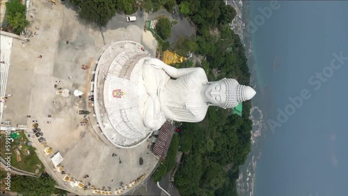 Vertical aerial view of Phuket Big Buddha, or The Great Buddha of Phuket, is a seated Maravija Buddha statue in Phuket, Thailand. This massive religious symbol towers above Phuket. photo