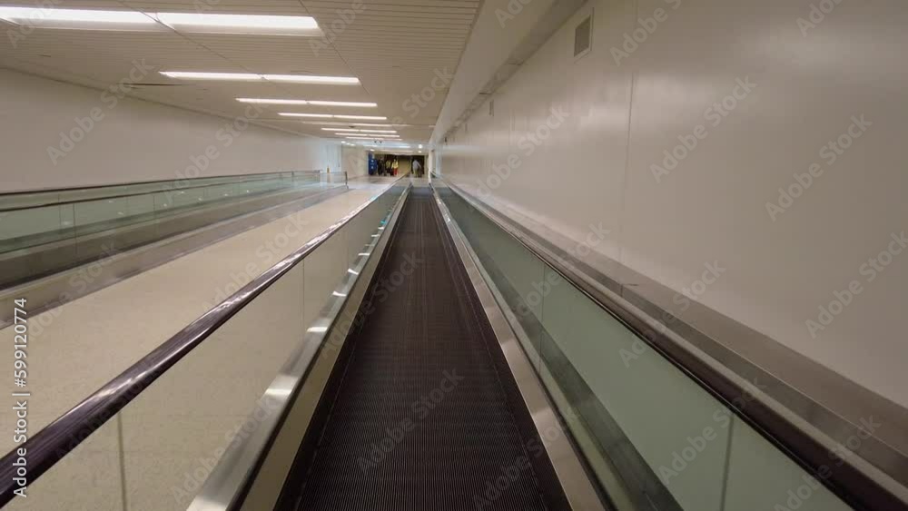 Interior view of a escalator tunnel in airport Interior view of a escalator tunnel in airport
