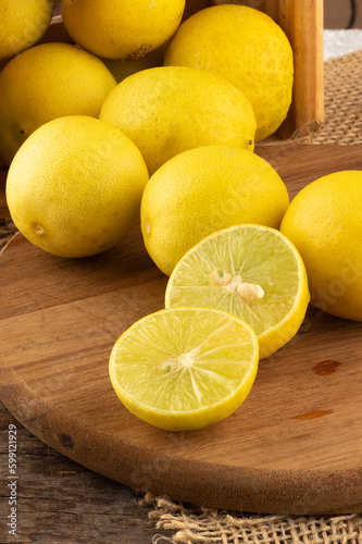 Brazilian lemon known as galego on cutting board.