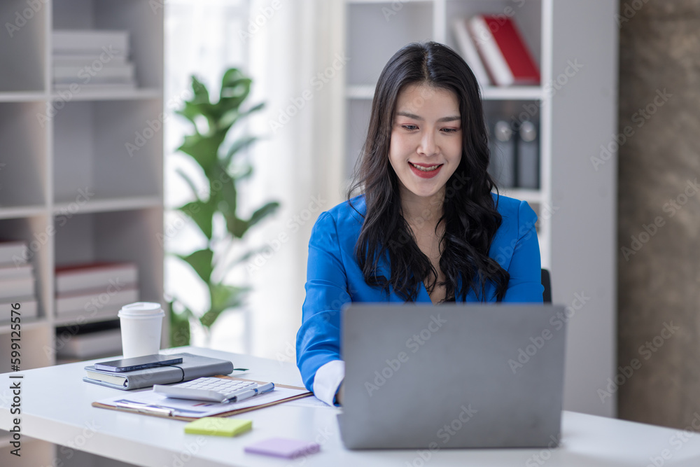 © David - Business asian woman working at office with documents on his desk, doing planning analyzing the financial report, business plan investment, finance analysis concept © David - Business asian woman working at office with documents on his desk, doing planning analyzing the financial report, business plan investment, finance analysis concept
