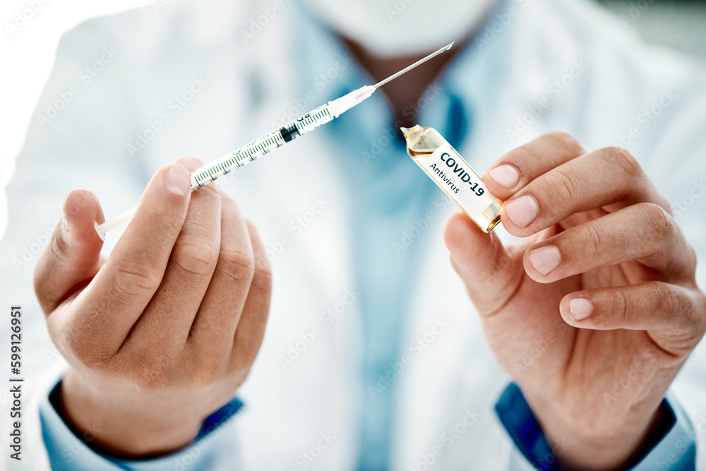Weve got a world to save. a scientist extracting medication using a syringe from an ampoule with 2019-nCov on it. Weve got a world to save. a scientist extracting medication using a syringe from an ampoule with 2019-nCov on it.