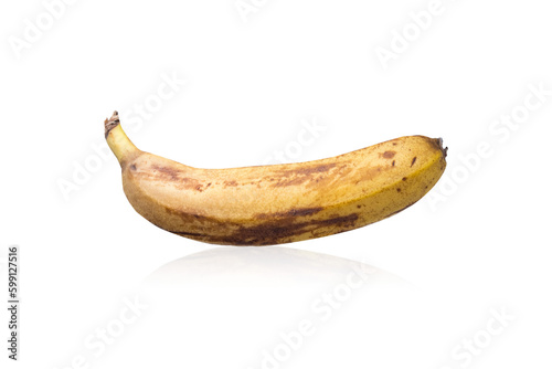 Blackened banana on a white background. Overripe banana on a white background.Spoiled banana on a white background.