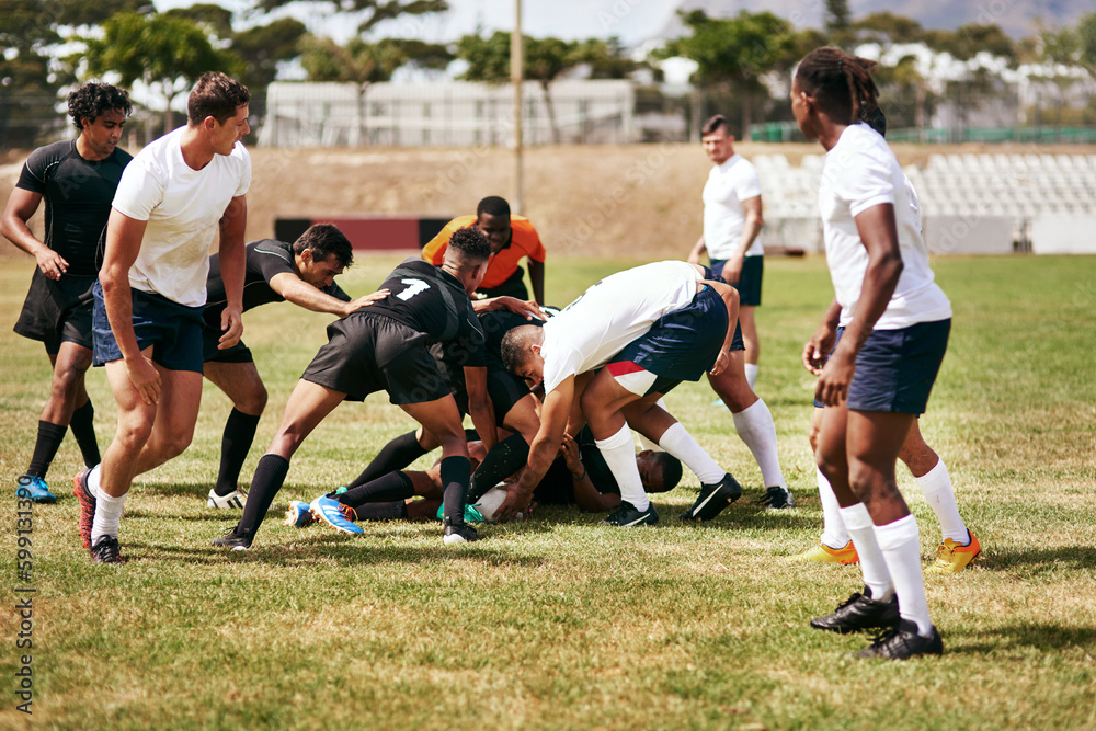 Brace yourself, rugby can be brutal. a group of young men playing a game of rugby. Brace yourself, rugby can be brutal. a group of young men playing a game of rugby.