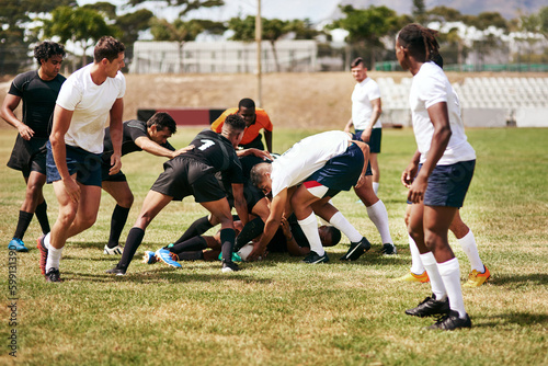 Brace yourself, rugby can be brutal. a group of young men playing a game of rugby. © C Malambo/peopleimages.com