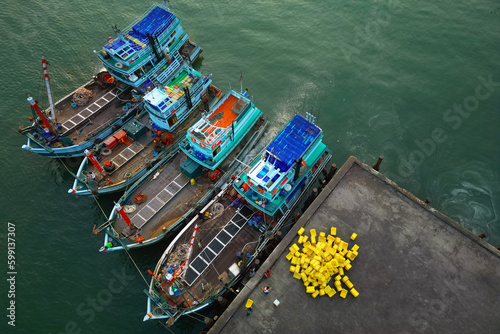 asian fisherman boat ,docks at the harbor © MICHEL