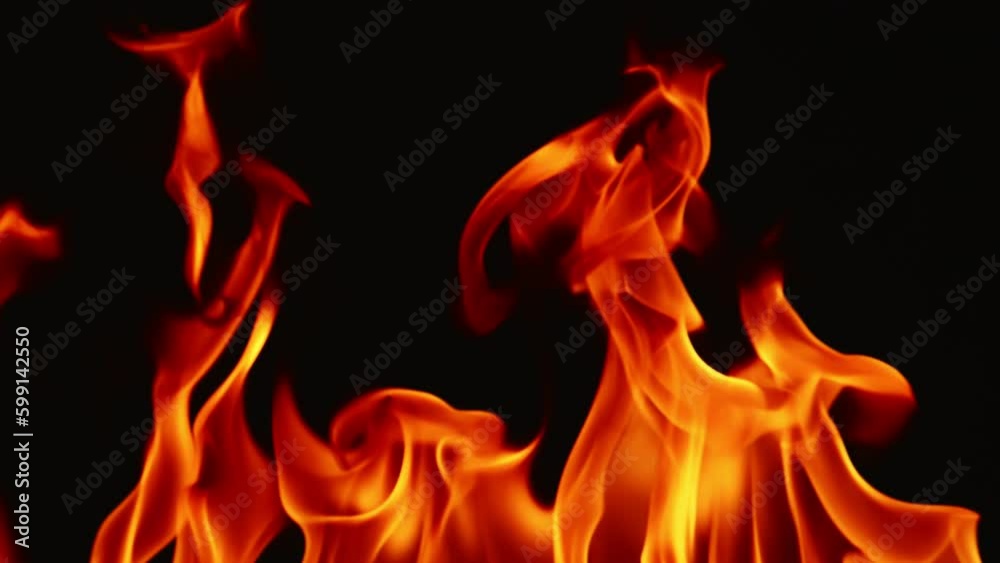 Slow motion video of fire and flames burning gas or gasoline ignited by fire and flames.
