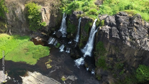 Descending drone footage above Pongour waterfall in Lam Dong province, Vietnam.  photo