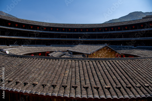 Close up on The roofs of the buildings inside Fujian earthen buildings (also known as Hakka tulou) in mountains. These buildings are in Chuxi village.
