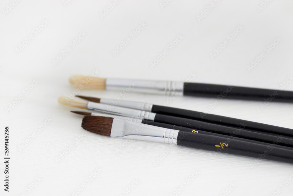Paint brush, creativity and table background with hobby and diy tool. Creative, painter and artist tools for house renovation, canvas or artistic work with equipment for painting and decorating Paint brush, creativity and table background with hobby and diy tool. Creative, painter and artist tools for house renovation, canvas or artistic work with equipment for painting and decorating