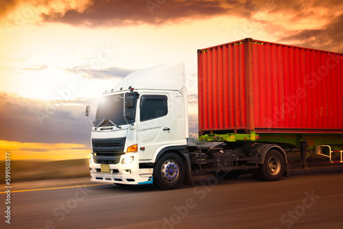 Semi Trailer Truck Driving on Highway Road with The Sunset Sky. Commercial Truck, Express Delivery Transit. Shipping Container Truck Transport. Freight Trucks Logistics Cargo Transport