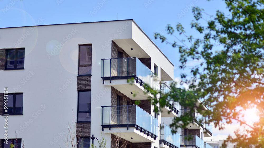 Modern apartment buildings on a sunny day with a blue sky. Facade of a modern apartment building. Contemporary residential building exterior in the daylight. 