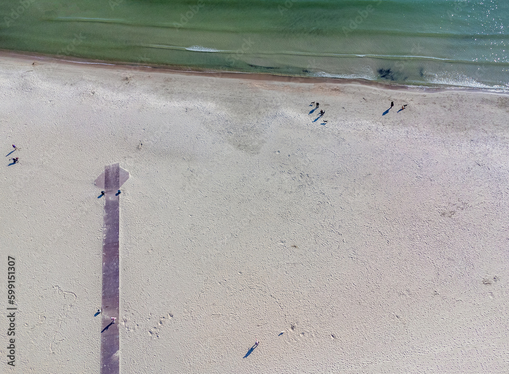 Aerial view landscape Poland Gdynia. City beach, view of sand and Baltic sea. Wooden path, footbridge.
