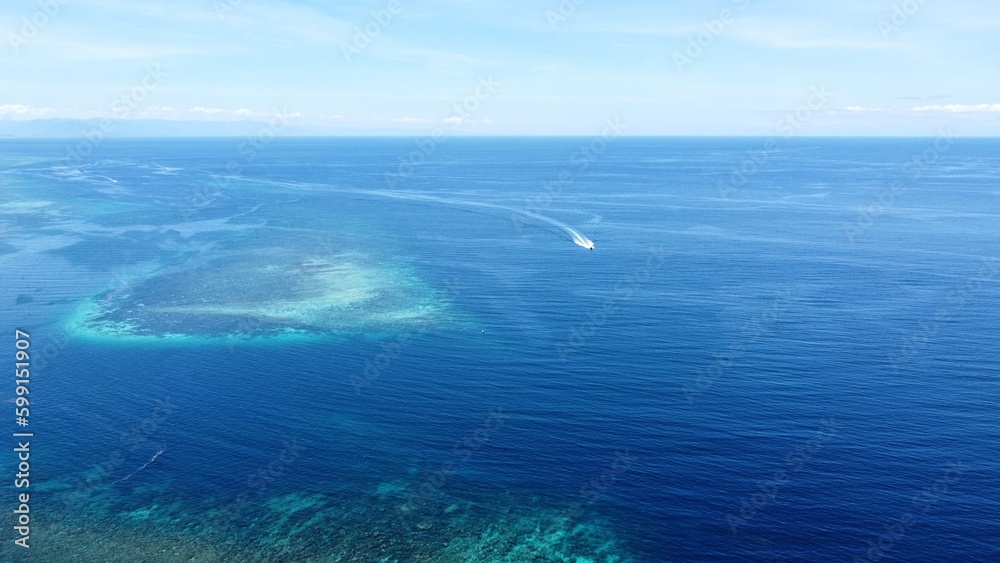 Scenic aerial view of coral reef ecosystem in vast deep blue water of Coral Triangle in Timor-Leste, Southeast Asia