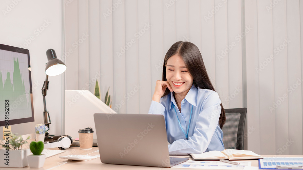 Businesswoman young asia is sitting at workplace and using a computer for working on marketing. Businesswoman young asia is sitting at workplace and using a computer for working on marketing.