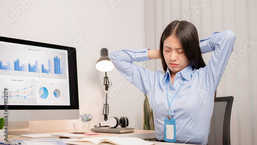 Photos Businesswoman asia is sitting at workplace and feeling muscle aches from hard work