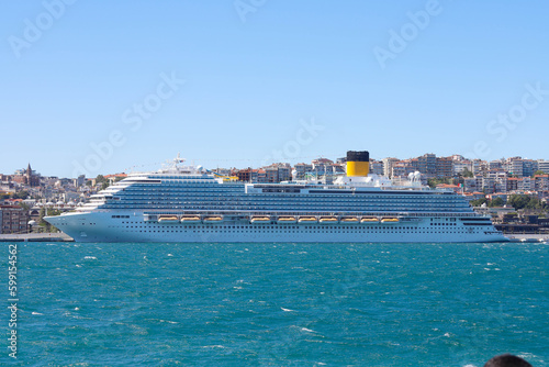 Cruise ship in city port in city port for tourist travel on sunny day. It waits at the port of Galataport , the tourist port of Istanbul. photo