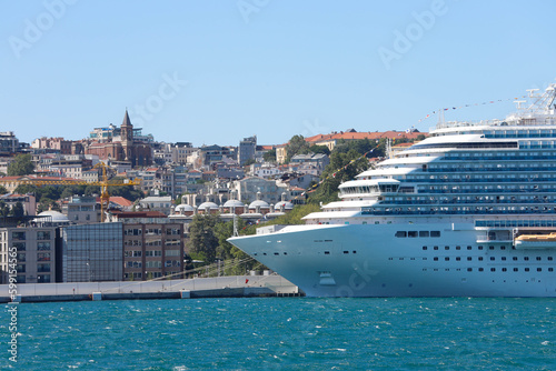 Cruise ship in city port in city port for tourist travel on sunny day. It waits at the port of Galataport , the tourist port of Istanbul.