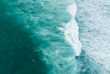 Drone shot of Surfer riding a wave in Oahu, Hawaii