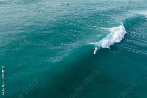 Surfer in hawaii gets barreled on a wave